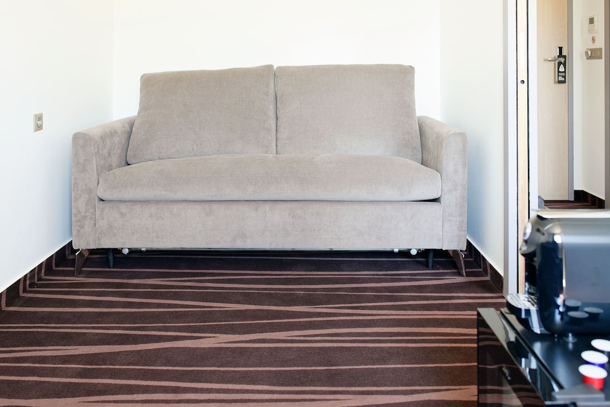 family room | premium bedding, desk, laptop workspace, soundproofing