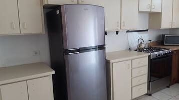 Apartment, 2 Bedrooms | Private kitchen | Fridge, microwave, coffee/tea maker, electric kettle