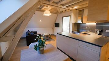 Apartment, 1 Bedroom (Plaqueminier) | Living area | Flat-screen TV