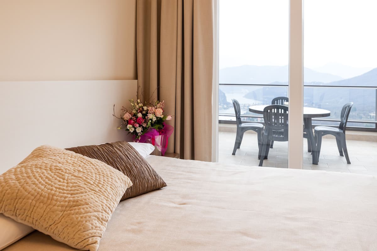 deluxe quadruple room, 1 bedroom, lake view | 1 bedroom, in-room safe, desk, free wifi