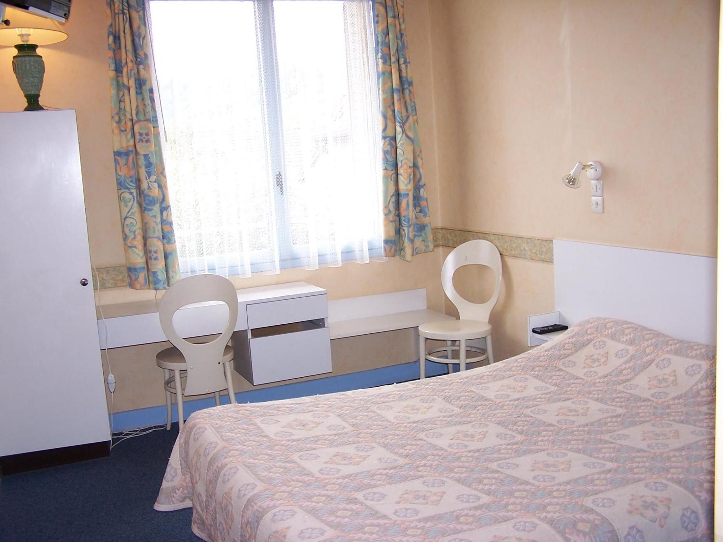 individually decorated, individually furnished, desk, blackout curtains