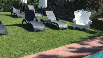Seasonal outdoor pool, open 9 AM to 8 PM, pool umbrellas, pool loungers