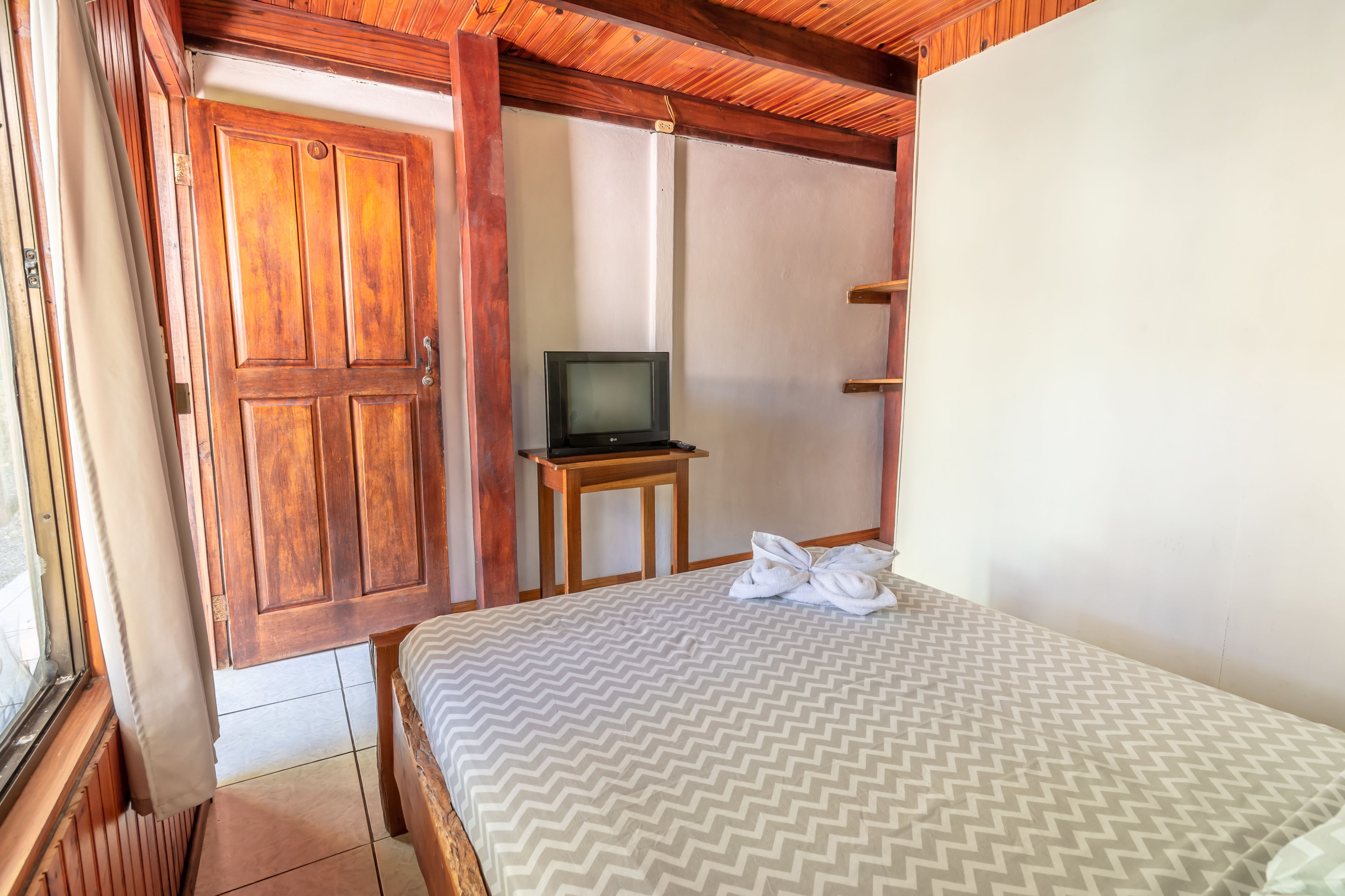 economy double room, 1 double bed, pool access, garden area | bed sheets