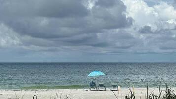 On the beach, sun loungers, beach towels