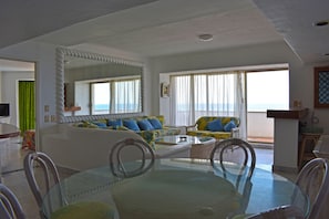 Panoramic Suite, 3 Bedrooms, Terrace, Ocean View | Living area | 32-inch flat-screen TV with cable channels, TV - Aca Suites Ixtapa (Ixtapa)