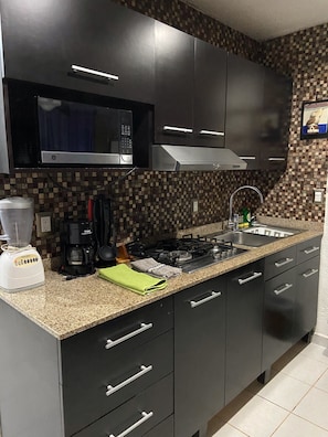 Fridge, microwave, coffee/tea maker, blender