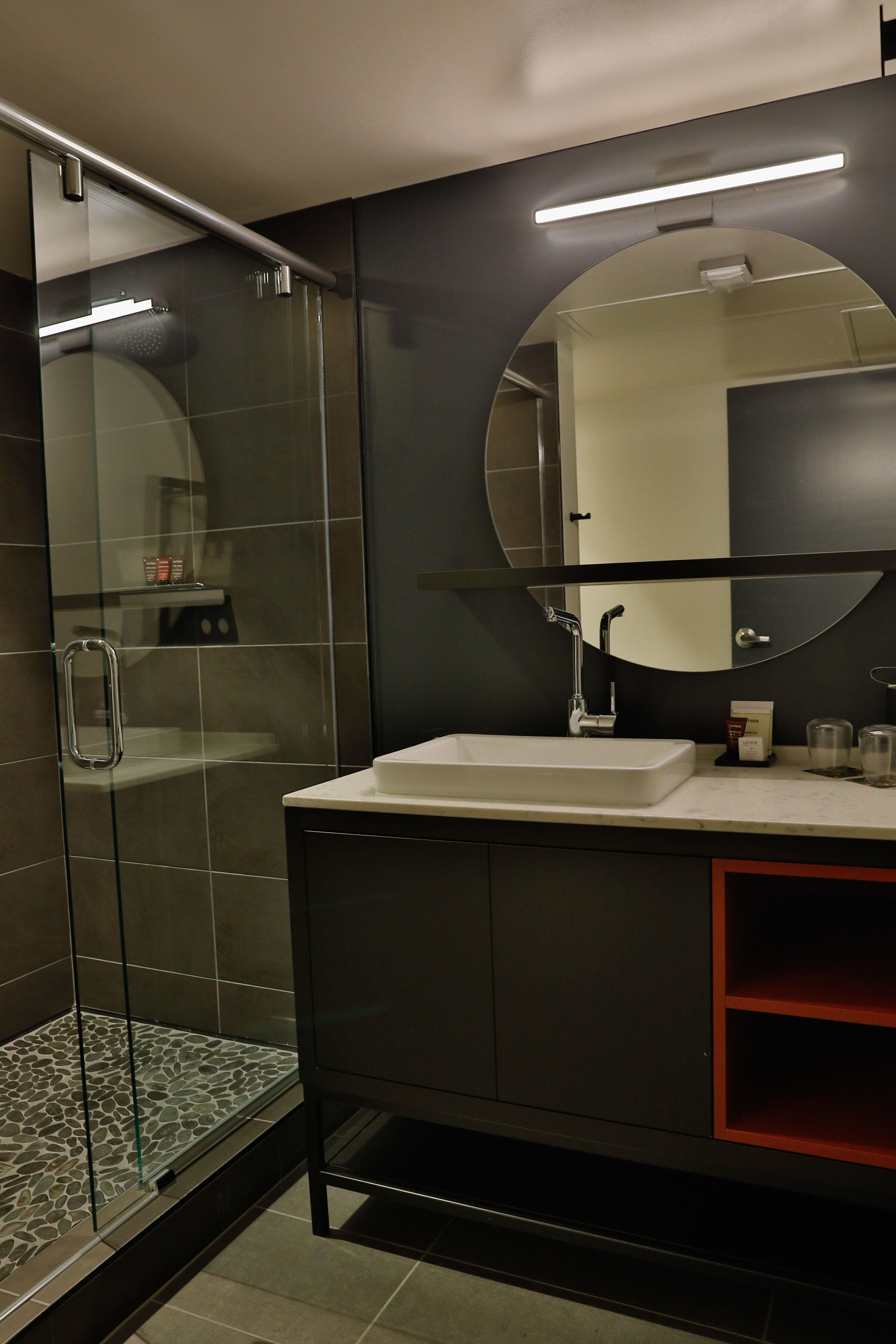 shower, designer toiletries, hair dryer, towels