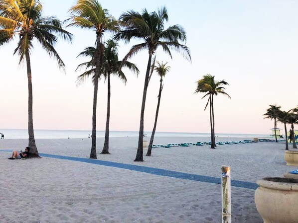 On the beach, sun-loungers, beach umbrellas, beach towels