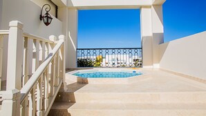 A pool area with a clear view of the sky and a distant cityscape. - Cap Cana Oceanfront Penthouse Marina Apartment, Sleeps 10, overlooks ocean (Punta Cana)
