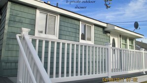 A two-story house with a wrap-around deck and a private outdoor shower. - LAVALLETTE New Panoramic Deck, Outdoor shower, and Kitchen INCLUDES BEACH BADGES (Lavallette)