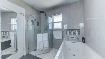 Bathtub, jetted bath, hair dryer, towels