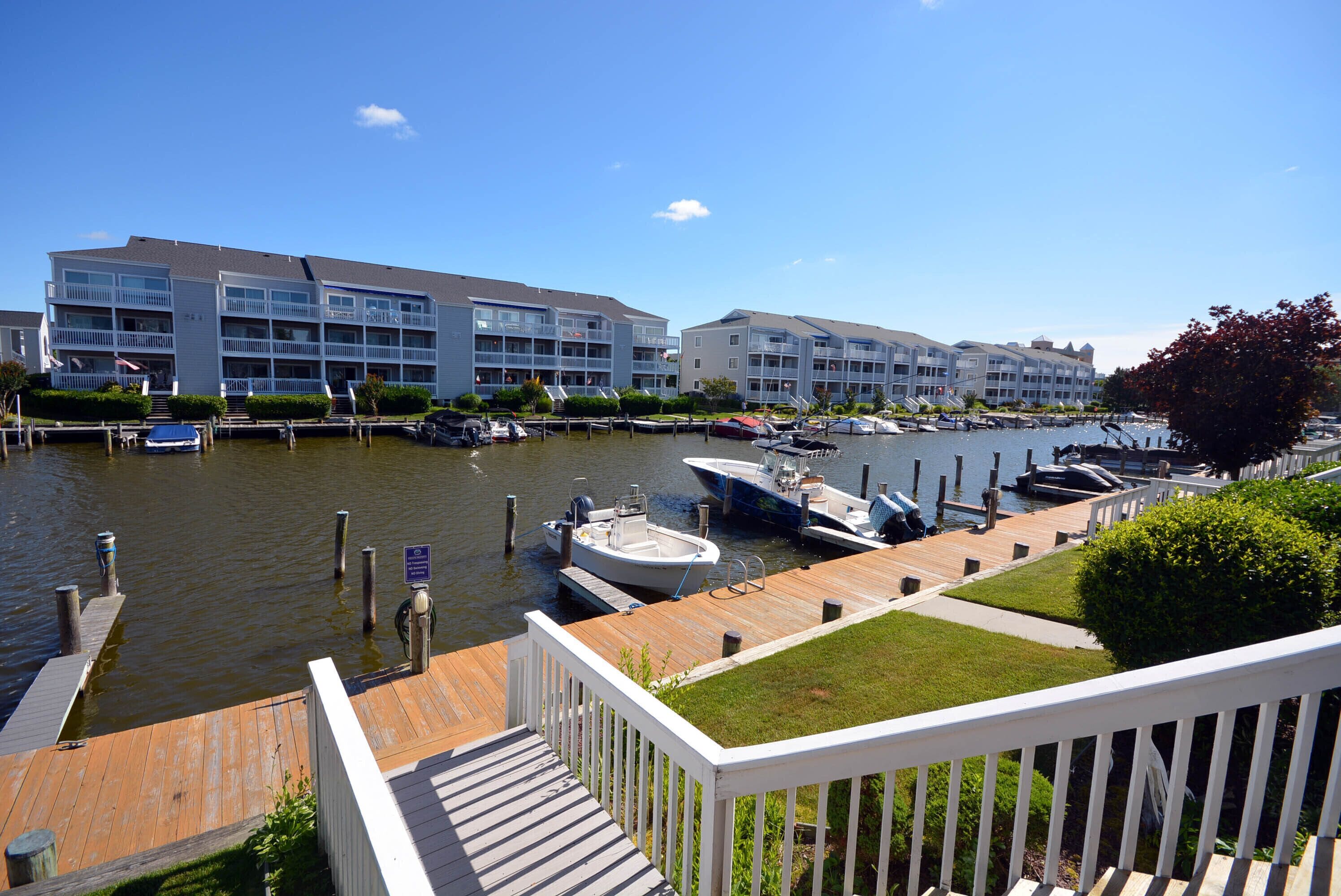 Cozy, inviting 1 bedroom condo with an outdoor pool and gorgeous canal-front view located uptown on the bayside just a few blocks from the beach!