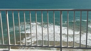 A view of the ocean from a balcony with a metal railing. - Luquillo, 18th Floor With Ocean Front  (Luquillo)