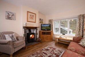 Lounge of tulip withcosy log burner