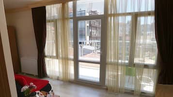 Deluxe Room, Balcony | Living area | LCD TV