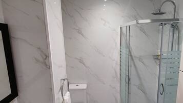 Shower, hair dryer, towels, soap