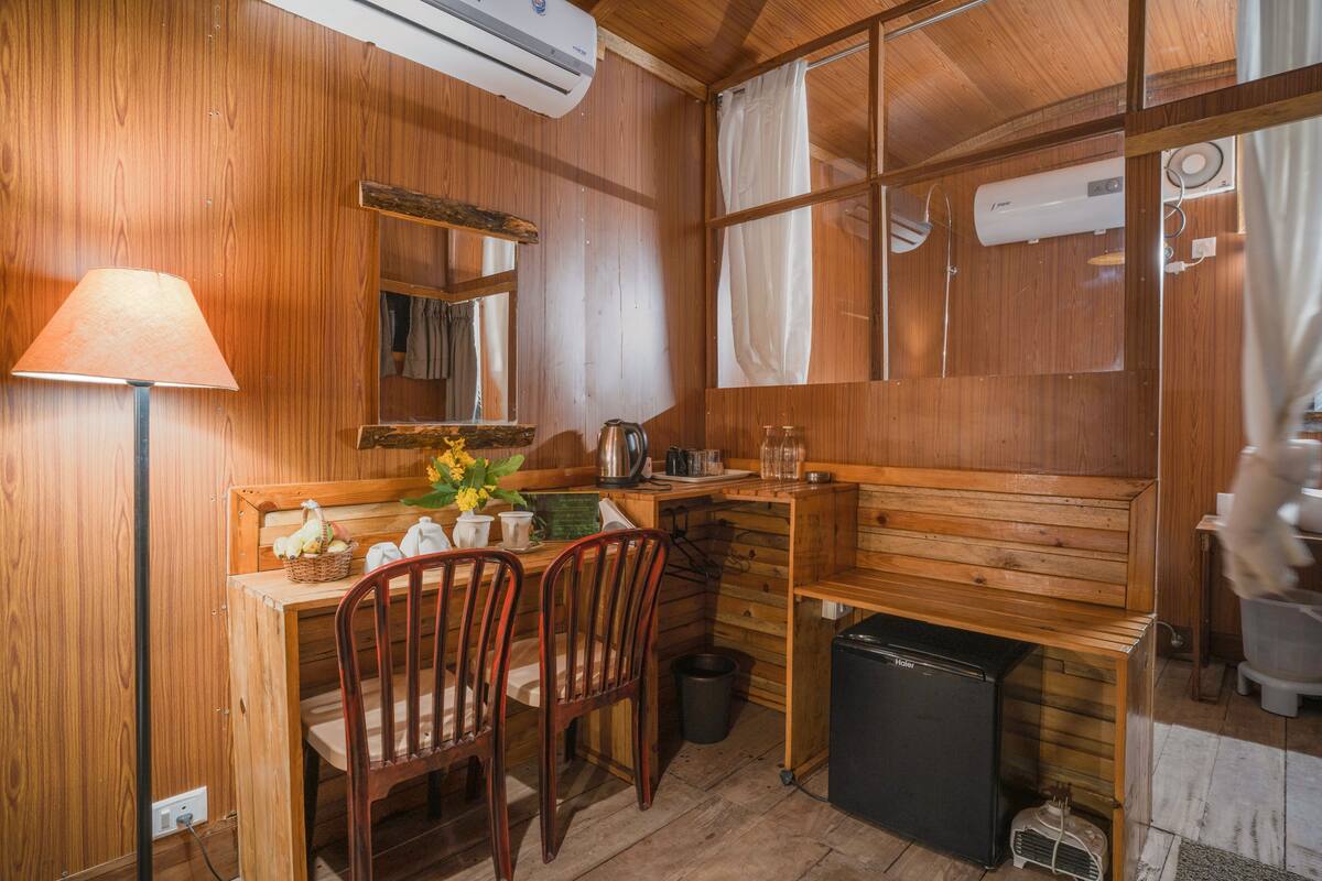 shepherd huts (honeymoon suite) | living area | 32-inch led tv with digital channels, tv, table football