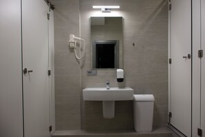 Shower, hair dryer, slippers, towels