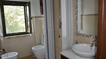 Apartment, 2 Bedrooms | Bathroom | Shower, free toiletries, hair dryer, towels