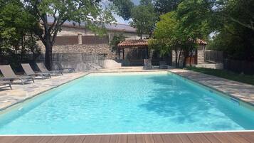 Seasonal outdoor pool, pool umbrellas, pool loungers