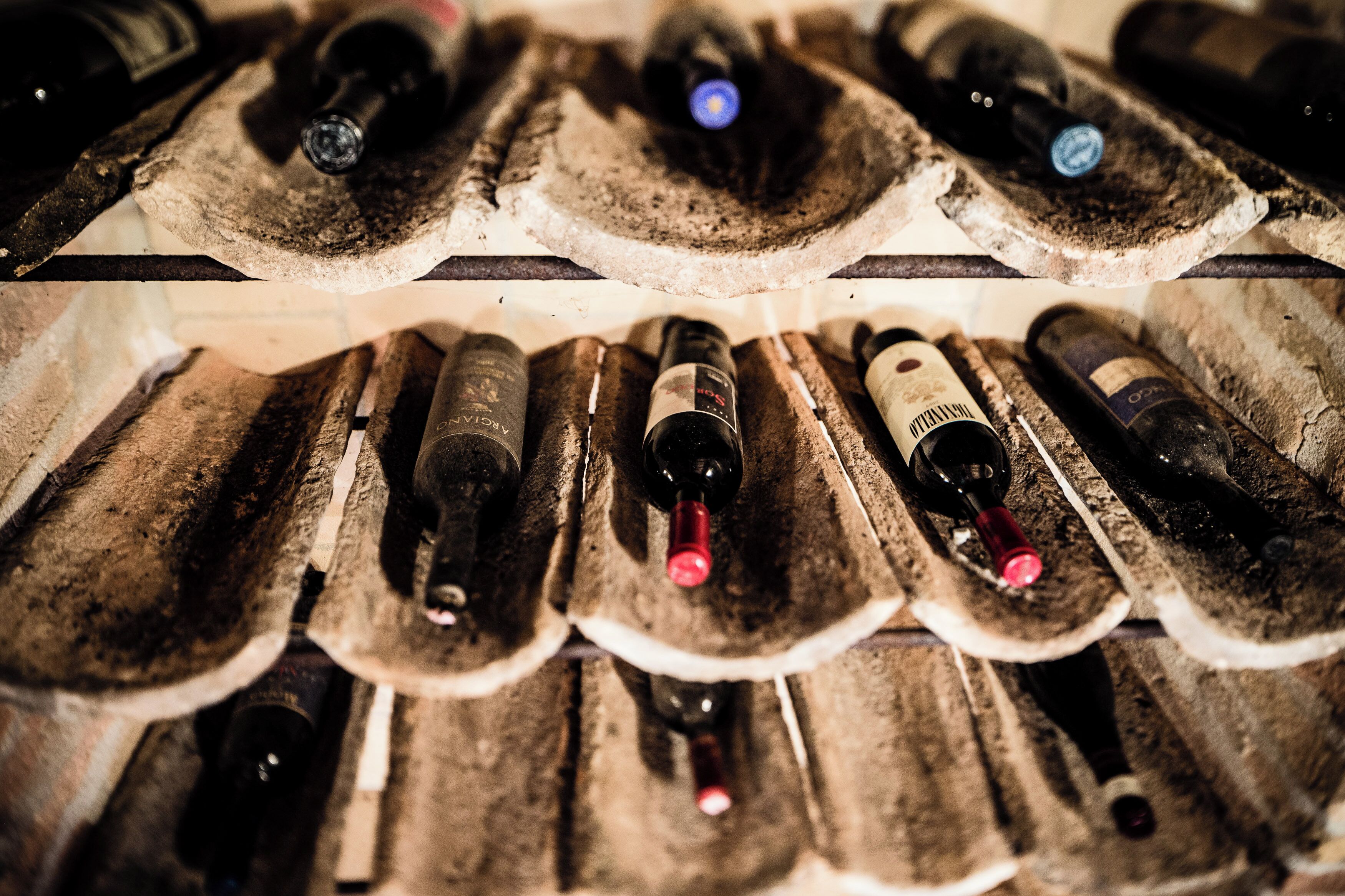 A wine rack with bottles arranged in rows.