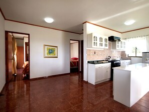 Family Cabin, 1 Bedroom, Kitchen, Garden View | Private kitchen | Full-size fridge, oven, stovetop, cookware/dishes/utensils - Honu Nui (Hanga Roa)