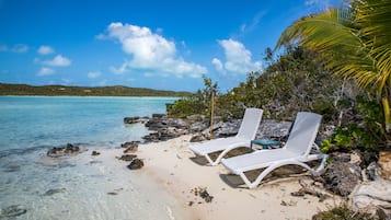 On the beach, sun-loungers, beach towels