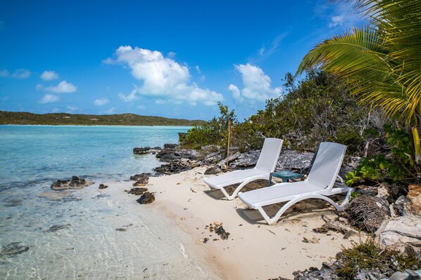 On the beach, sun loungers, beach towels