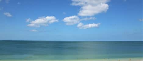 On the beach, sun loungers, beach towels