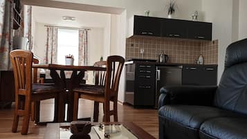 Deluxe Apartment, 1 Bedroom, Kitchenette | Living area | 80-cm LCD TV with digital channels, TV