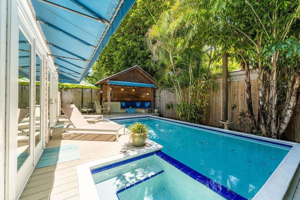 Welcome to Bottom’s Up Bungalow located The Meadows subdivision in Old Town Key West. <br><br>This pristine Florida Bungalow is 2 bedrooms, 2 bathroom single family home and offers all the amenities you need to make this your perfect vacation. Including off-street parking, swimming pool, quaint gazebo equipped with wet bar and custom seating. The home has ample storage, polished hardwood floors, central air formal and two informal dining areas, spacious kitchen and living spaces throughout.<br><br>The Lush, tropical gardens enhanced by landscape lighting, privacy fencing and oversized pool make this the perfect place to relax and enjoy time with family and friends in every season. <br><br>Home Details: <br><br>Living Room - Sectional sofa with sofa sleeper, sitting chair, flatscreen TV and full of natural light. <br><br>Formal Dining - Just off the living room is the formal dining area with seating for 4<br><br>Kitchen- The spacious open floor plan kitchen has ample counter space and is outfitted with all of your kitchen “must haves”. A breakfast bar with bar seating and informal dining area is also found off the kitchen. Double French Doors lead out to pool & rear patio. <br><br>Primary Suite - King size bed with chest of drawers, large closet, full size washer & dryer in closet. Double French Doors lead out to pool & rear patio. <br><br>Primary Bathroom - Located in the hallway next to the primary suite and has a spacious custom shower, vanity, toilet and ample storage space in the linen closet. <br><br>Guest Bedroom- 2- Twin beds (can also be converted to a king bed upon request) chest of drawers, spacious closet and en-suite bathroom with shower, vanity & toilet.<br><br>Pool Area / Gazebo- An oversized pool (heated from 12/1-5/1 only) whirlpool spa (not hot tub) is attached to pool and is surrounded by an elevated deck. With 2 sun loungers, outdoor dining table and chairs with umbrella and a custom covered gazebo with wet bar. <br><br>Parking- There is 1 assigned parking space in the driveway. Additional vehicles can park roadside as available. <br><br>Bottom’s Up Bungalow is located in the perfect location and is a quiet community close to the downtown action of Key West. The home is less than 1 mile to Duval Street, Beaches and Marina. It is on a one way street so traffic is very minimal.<br><br>We hope you will be our guest and join us at Bottom’s Up Bungalow on your next trip to Key West! <br> BOTTOMS UP BUNGALOW - 2 Bedroom / 2 Bathroom With PRIVATE POOL