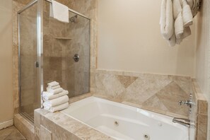 Bathtub, jetted tub, hair dryer, towels