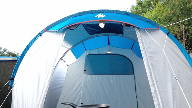 A dome-shaped tent with a table in front, a portable stove, and two glasses. - Burren Bushcraft - Camping & Adventures (Carran)