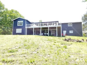 A two-story house with a covered porch and a small deck. - Lakefront - Gentle Slope to Water - Sleeps 18 (Shell Knob)