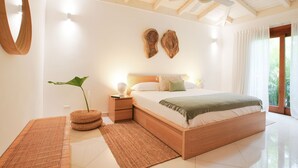 A modern bedroom with a wooden bed, a ceiling fan, and a large window with curtains.