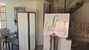 A room with a desk, a chair, a decorative sign, and a staircase. - Beach Front Convenience..Steps to the Beach and Pool !  (Puerto penasco)