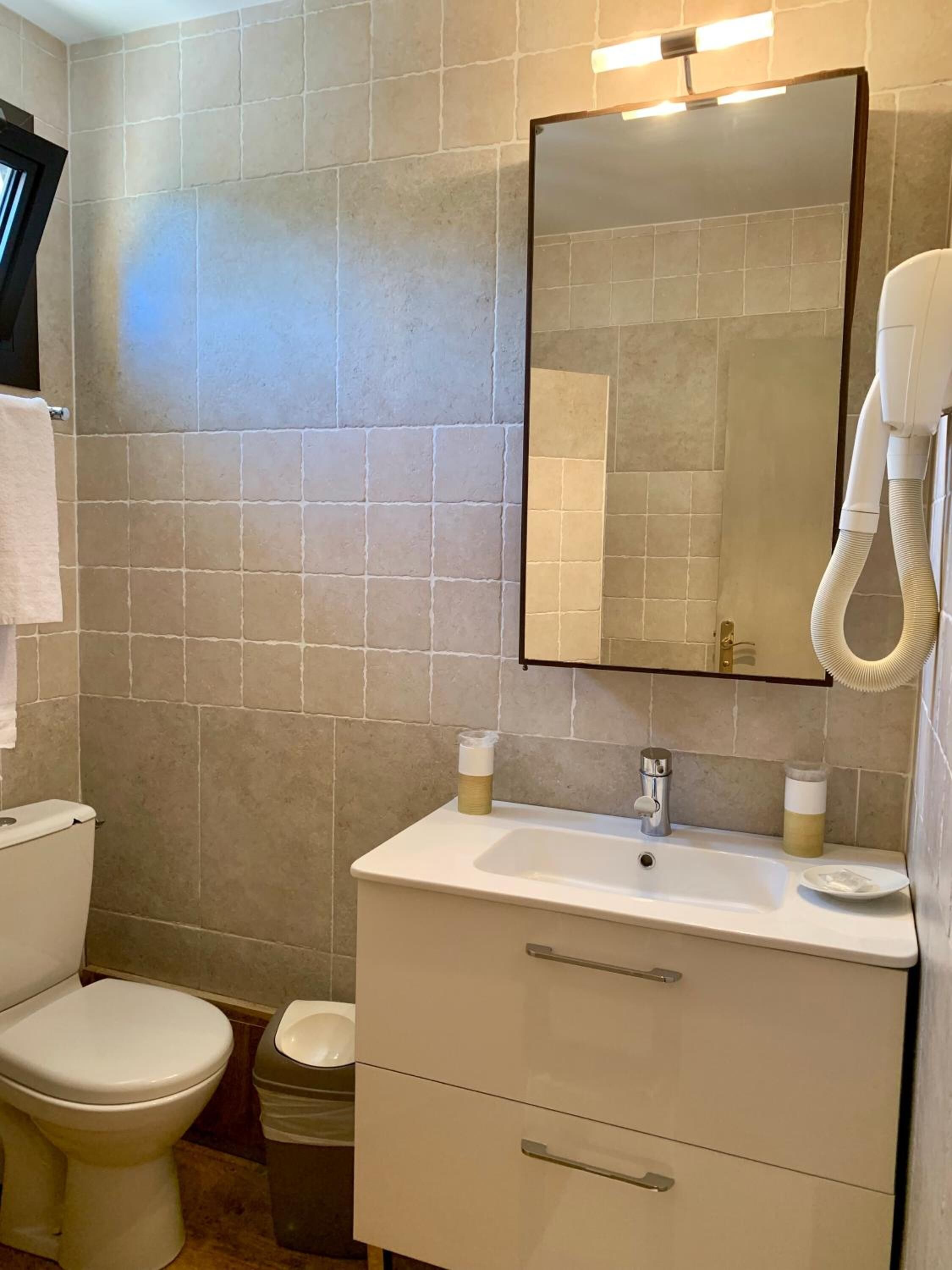 deep-soaking bathtub, hair dryer, towels