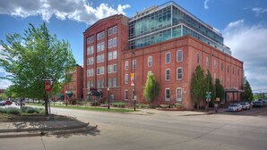 A red brick building with a modern glass extension.