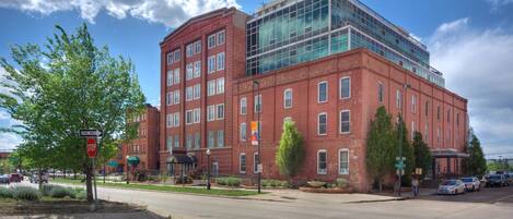 A red brick building with a modern glass extension.