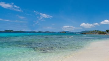 On the beach, sun loungers, beach towels