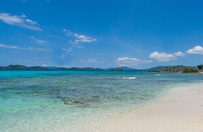 On the beach, sun-loungers, beach towels