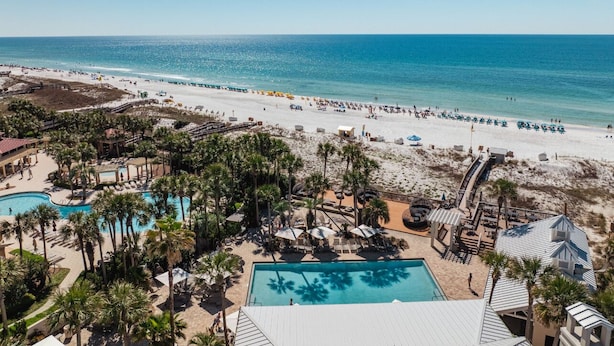 A resort with a pool, beach, and ocean view. - LAKEFRONT! UPDATED IN PAST 3 months ! Fish out back from porch! Minutes to beach (Miramar Beach)