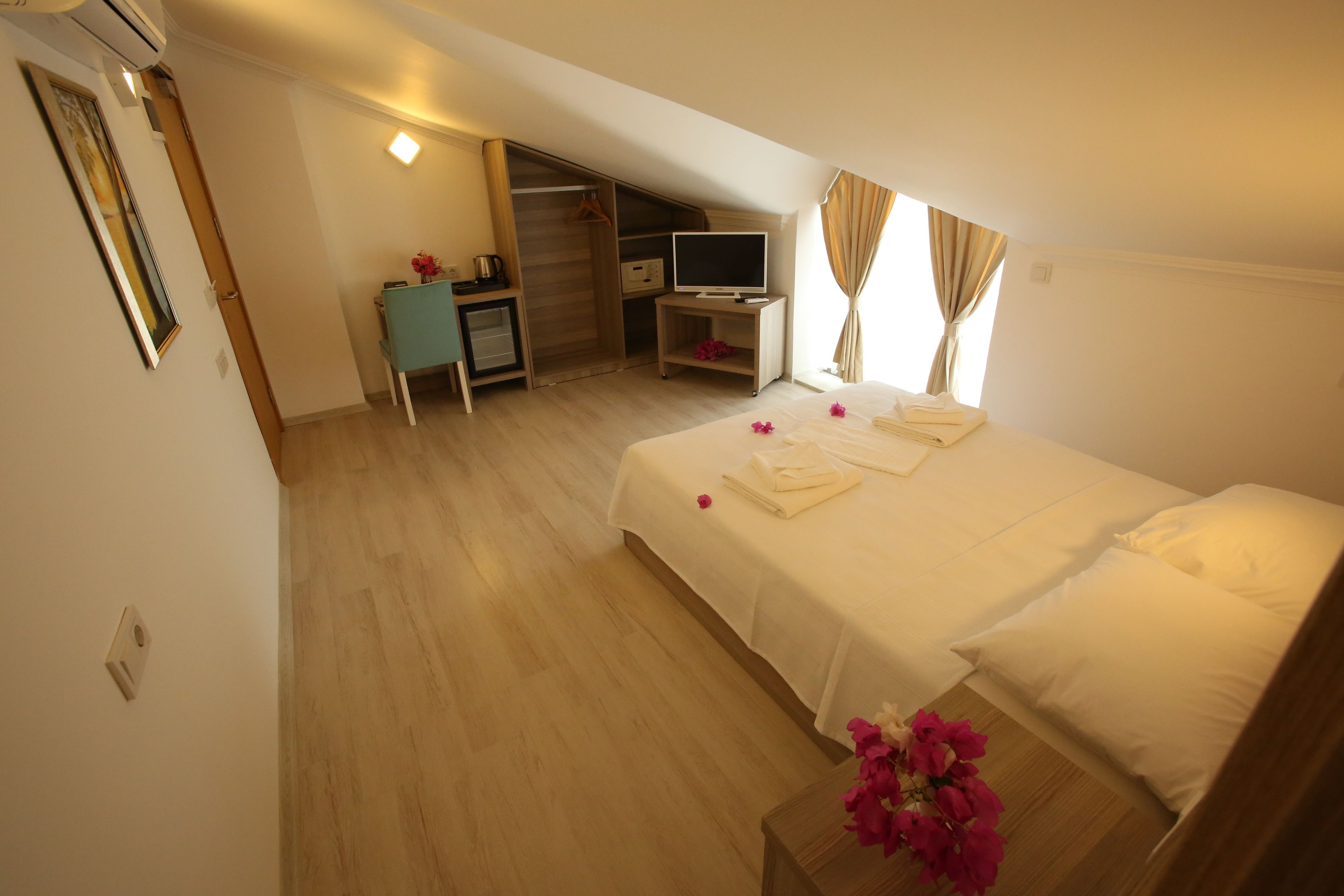 economy room, mountain view (attic) | premium bedding, minibar, in-room safe, desk