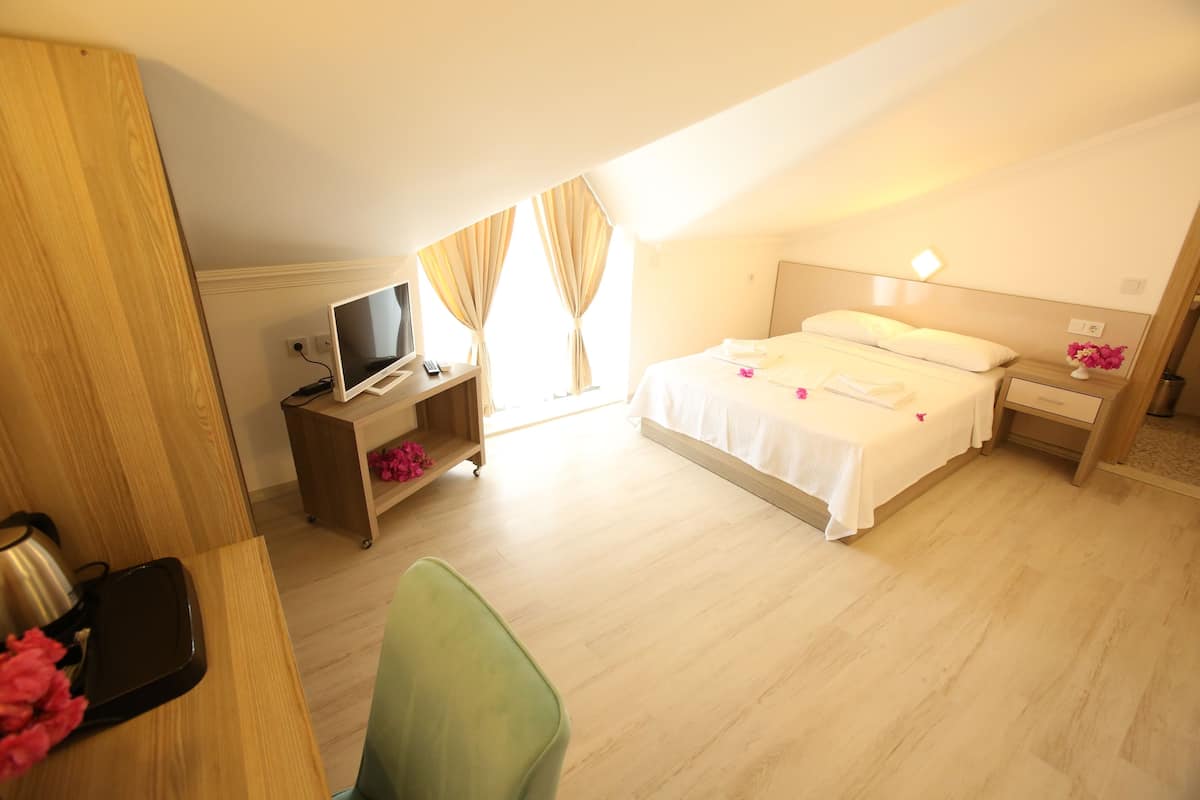 economy room, mountain view (attic) | premium bedding, minibar, in-room safe, desk