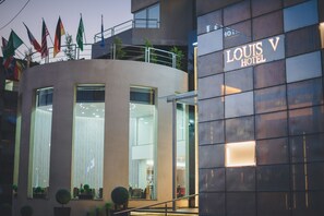 Experience the Louis V Hotel's sleek, modern design and enjoy the view from the balcony area.