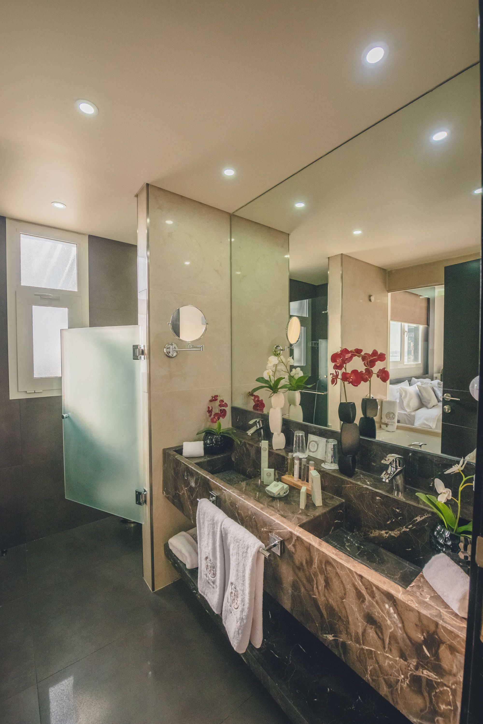 designer toiletries, hair dryer, bathrobes, slippers