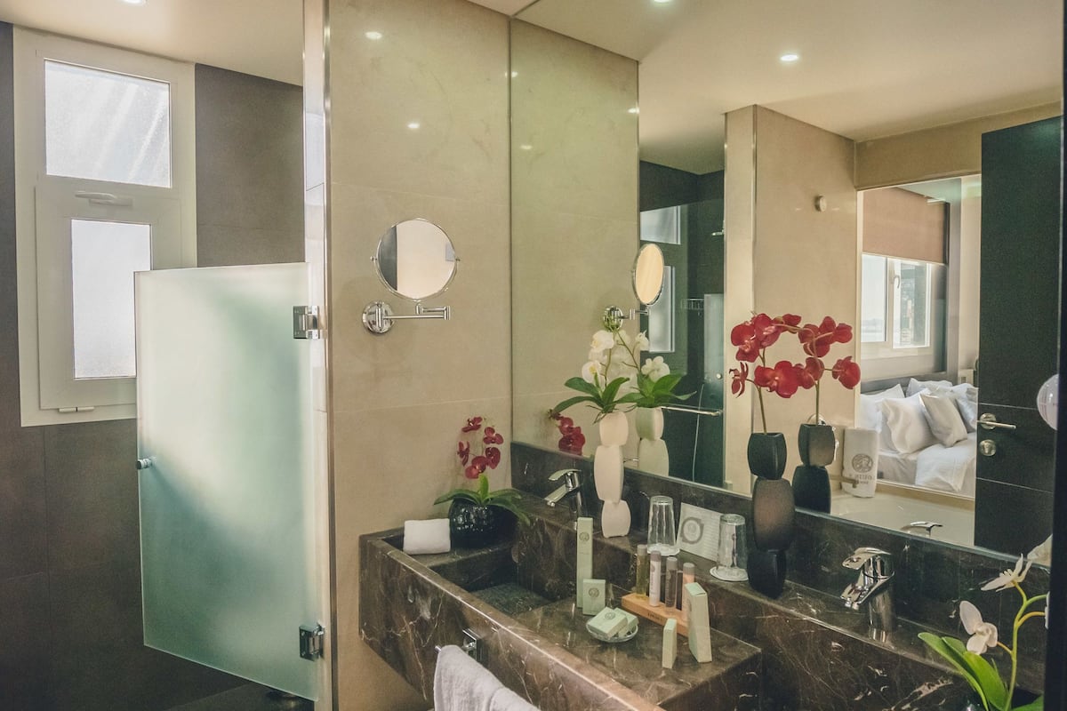 designer toiletries, hair dryer, bathrobes, slippers