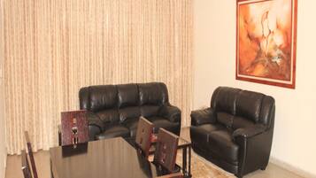 Comfort Penthouse, 2 Bedrooms, Balcony | Living area | Flat-screen TV
