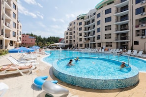 Seasonal outdoor pool, pool loungers