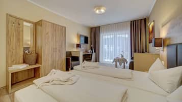 Ropa de cama hipoalergénica y tabla de planchar con plancha